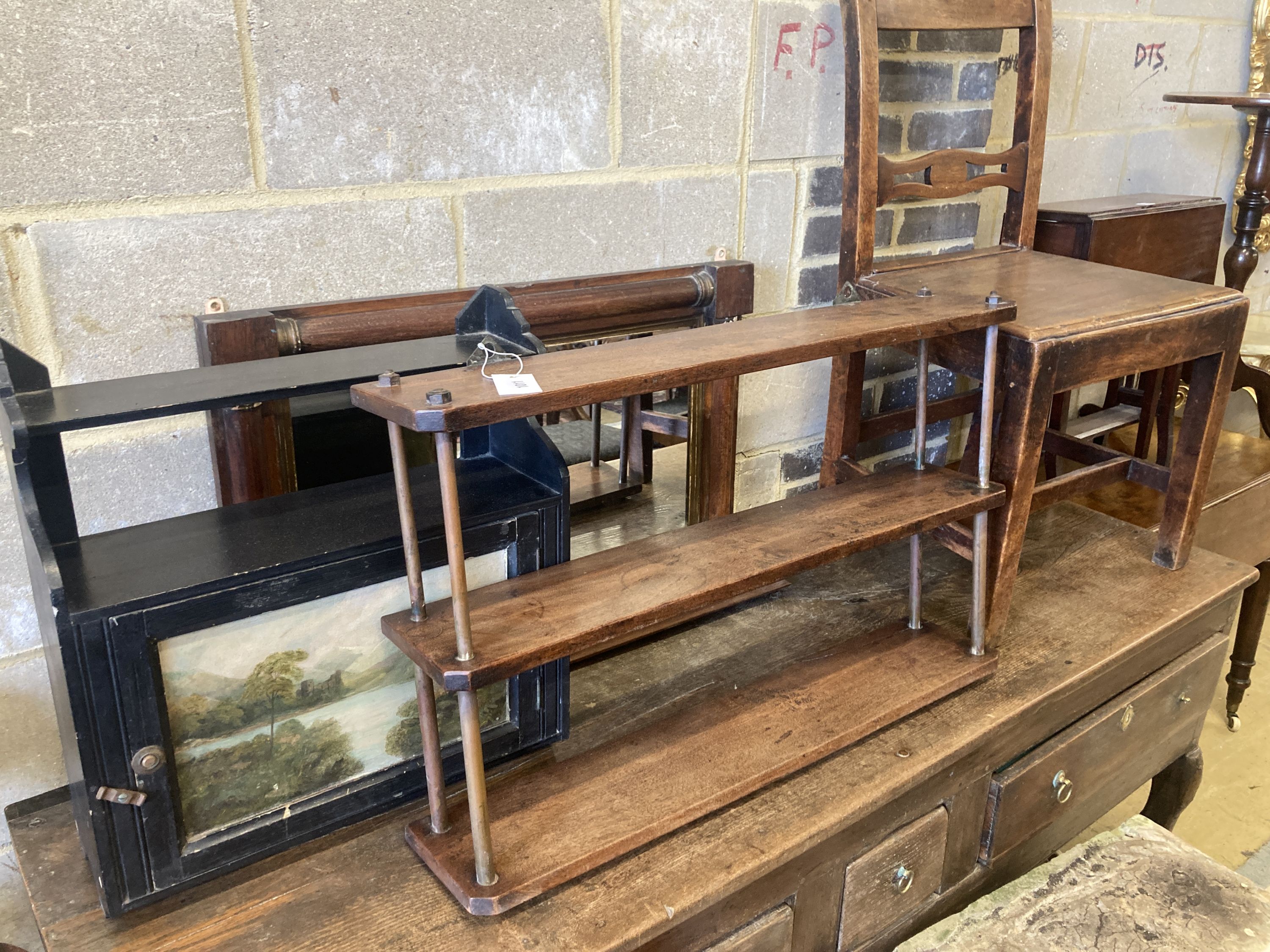 A late Victorian wall cabinet painted with a landscape scene, width 47cm, pair of provincial wood seat chairs, a mahogany three tier wall shelf and a Victorian overmantel mirror